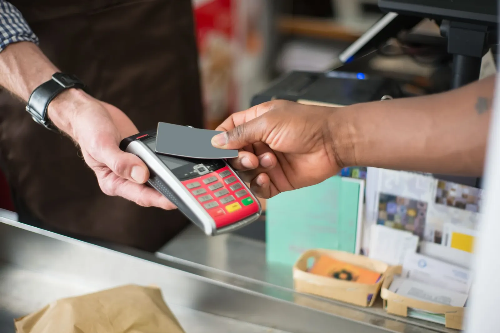Customer tapping a card to pay
